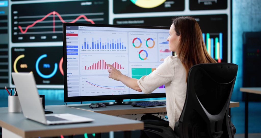 A woman looking at an analytics dashboard